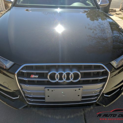 A close up of the front end of an audi.